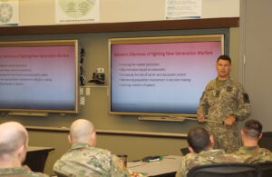 Maj. Egidijus Cuitas, an international military student in the current CGSOC class, presents his award-winning paper during a breakout session at the 2018 Fort Leavenworth Ethics Symposium. His paper entitled “Criminal Ethos of Russia – The Great Western Dilemma of Fighting New Generation Warfare” was one of two selected as the top papers for the symposium.
