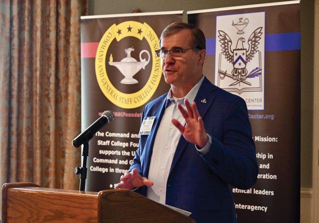 Retired Col. Steve Banach provides his presentation on virtual warfare for the Arter-Rowland National Security Forum luncheon event on Feb. 24, 2022, at the Carriage Club in Kansas City.