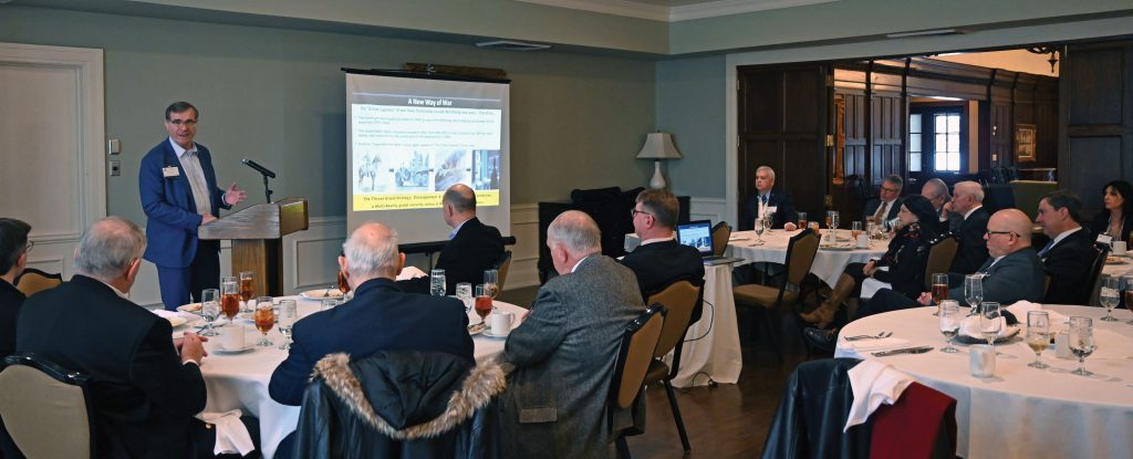 Retired Col. Steve Banach provides his presentation on virtual warfare for the Arter-Rowland National Security Forum luncheon event on Jan. 27, 2022, at the Carriage Club in Kansas City.