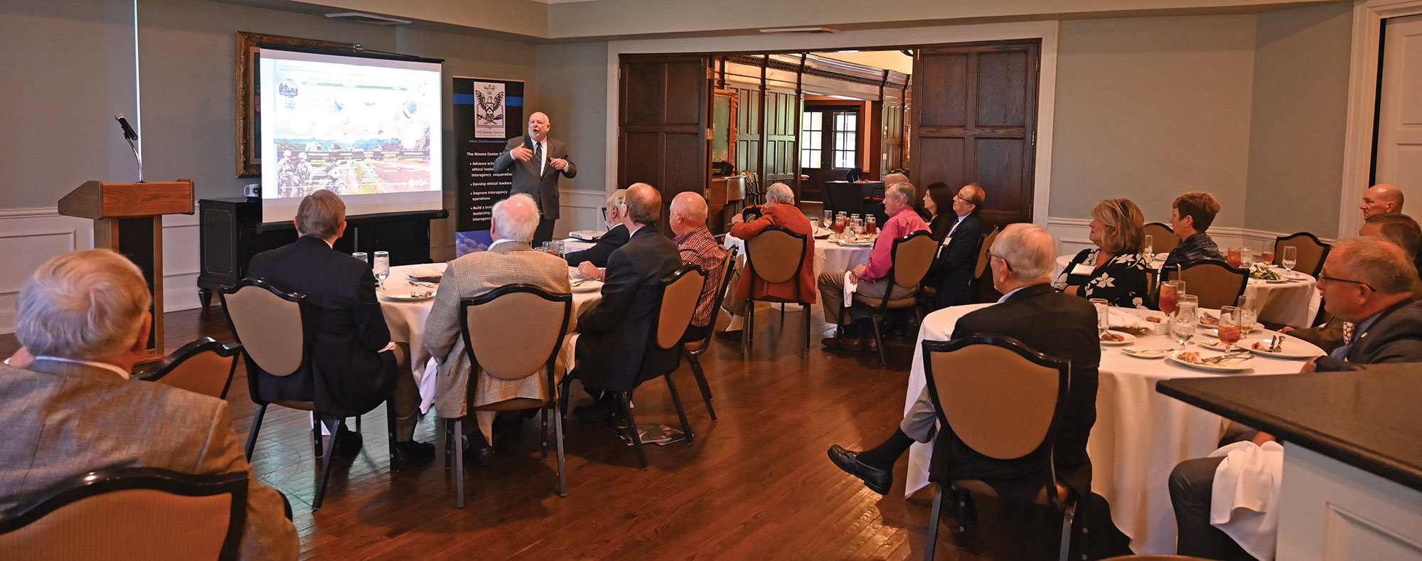 Mr. Ralph Erwin, the strategic advisor for Tesla Government, Inc., delivers his presentation on geospatial intelligence for the Arter-Rowland National Security Forum luncheon event on Sept. 29, 2022, at the Carriage Club in Kansas City.