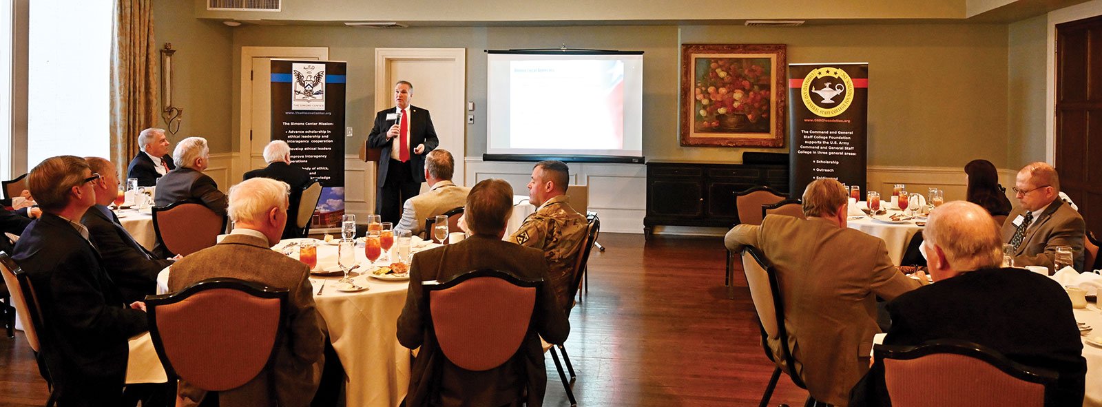 Larry A. Hisle, executive director of the Greater Kansas City Federal Executive Board (FEB), provides a presentation on the roles and missions of the Greater Kansas City Federal Executive Board to members of the Arter-Roland National Security Forum on Nov. 17, 2022, at the Carriage Club in Kansas City.