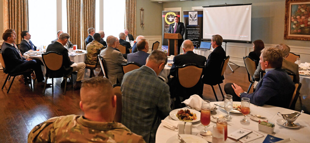 Phil Kirk, Region 7 Director for the Cybersecurity and Infrastructure Security Agency (CISA) in the U.S. Department of Homeland Security (DHS), delivers a presentation on the mission of Region 7 of CISA on May 18, 2023, at the Carriage Club in downtown Kansas City. 
