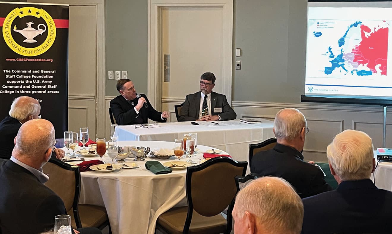 ARNSF DEC w Dr. Sean Kalic, left, and Dr. Mark Wilcox, professors at the U.S. Army Command and General Staff College, discuss the Simon’s Center’s Cold War Symposium and the culmination of that work in the book they co- edited, "The End of the Cold War and its Aftermath," during the Arter-Rowland National Security Forum luncheon event on Dec. 7, 2023, at the Carriage Club in Kansas City.