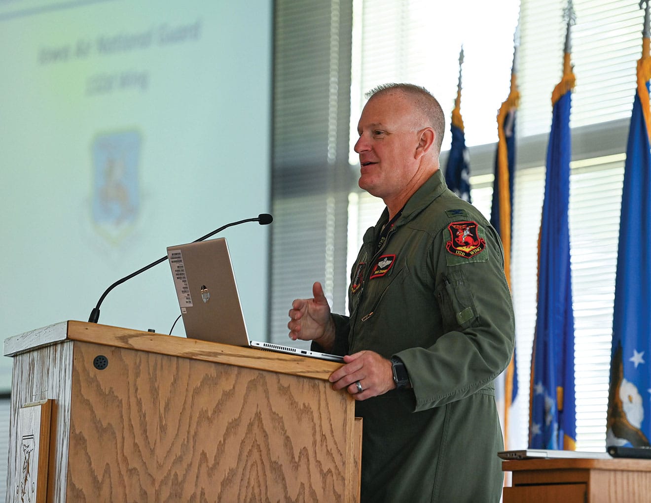 Z LN w Col. Travis Crawmer, 132d Wing commander, addresses participants during the Des Moines National Security Forum at the 132nd Wing headquarters in Des Moines, Iowa, July 17, 2024. Crawmer presented an introduction and overview of the 132nd Wing mission sets and capabilities.