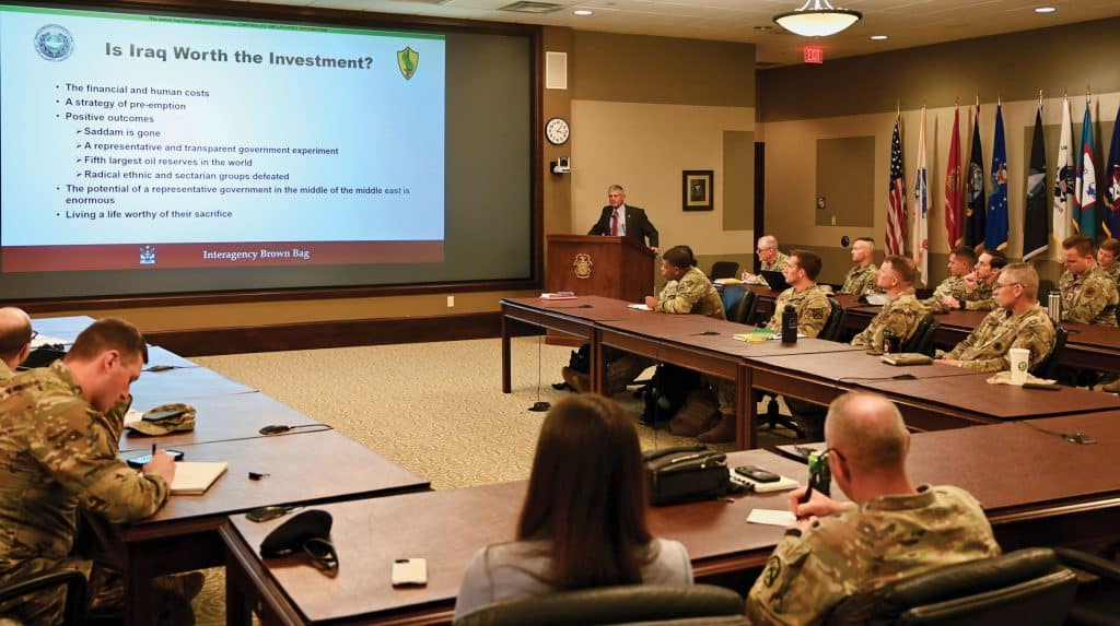 Retired Lt. Gen. Robert L. Caslen, Jr., the former chief of the Office of Security Cooperation in Iraq, conducts a presentation and discussion on his recently published book "The Impossible Mission," for attendees of the InterAgency Brown-Bag Lecture Series hosted by the CGSC Foundation and it's subordinate program, the Arthur D. Simons Center for Ethical Leadership and Interagency Cooperation on Oct. 15, 2025, in the Arnold Conference Room of the Lewis and Clark Center on Fort Leavenworth, Kansas.