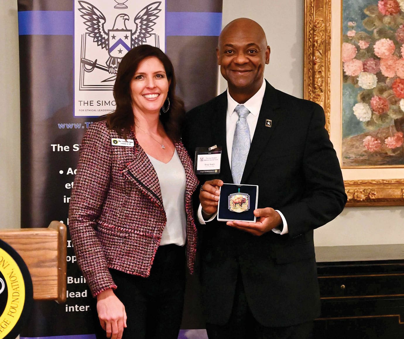 CGSC Foundation President/CEO Lora Morgan presents Lt. Gen. (Ret.) Milford H. Beagle, Jr., with the newest Foundation holiday ornament in appreciation for his time with the Forum during the ARNSF holiday social on Dec. 9, 2025. All ARNSF members also received an ornament in appreciation for their membership.