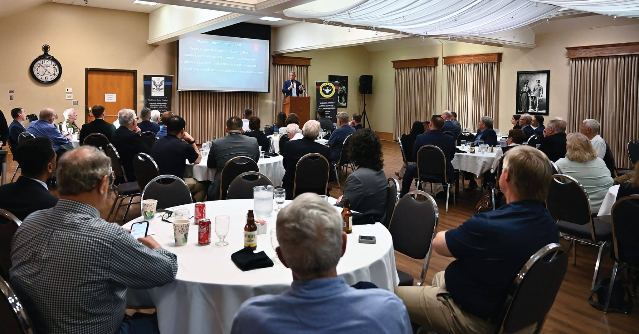 DSS w Maj. Gen. (Ret.) William Hickman, a veteran with extensive NATO experience, conducts a presentation and discussion about NATO during during the Distinguished Speaker Series event hosted by the CGSC Foundation and its Simons Center at the Riverfront Community Center in downtown Leavenworth, Kansas on April 15, 2026.
