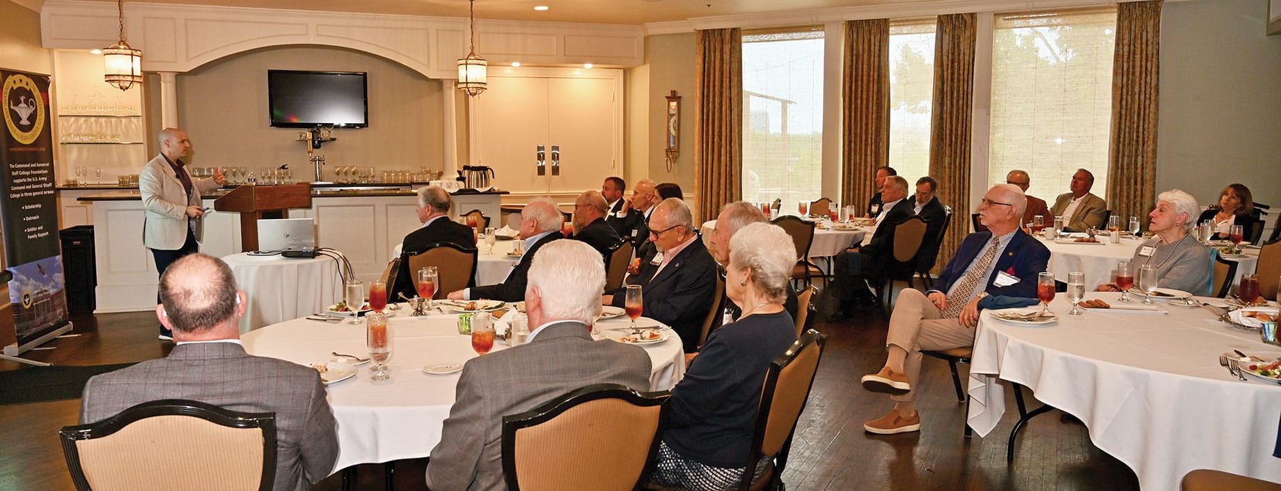 Jason J. Galui, director of the Endicott Center for Civic Participation, conducts a presentation and discussion about presidential decision making during the Arter-Rowland National Security Forum luncheon event at the Carriage Club in Kansas City on May 21, 2026.