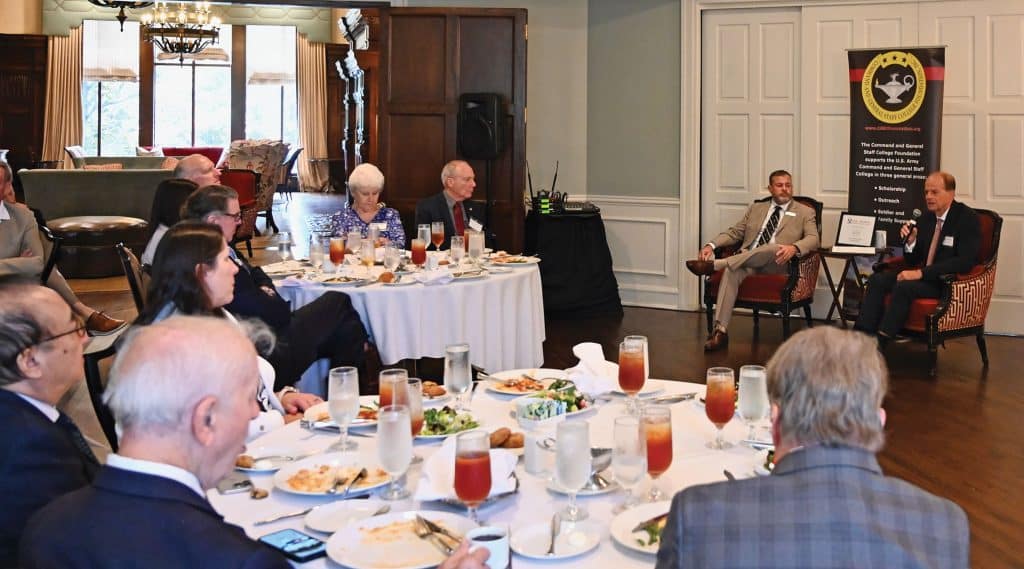 Tom Sheehy, right, principle of Quinella Global, discusses U.S. foreign policy with Simons Center Director Todd Schmidt during the Arter-Rowland National Security Forum luncheon event at the Carriage Club in Kansas City on Sept. 17, 2026.
